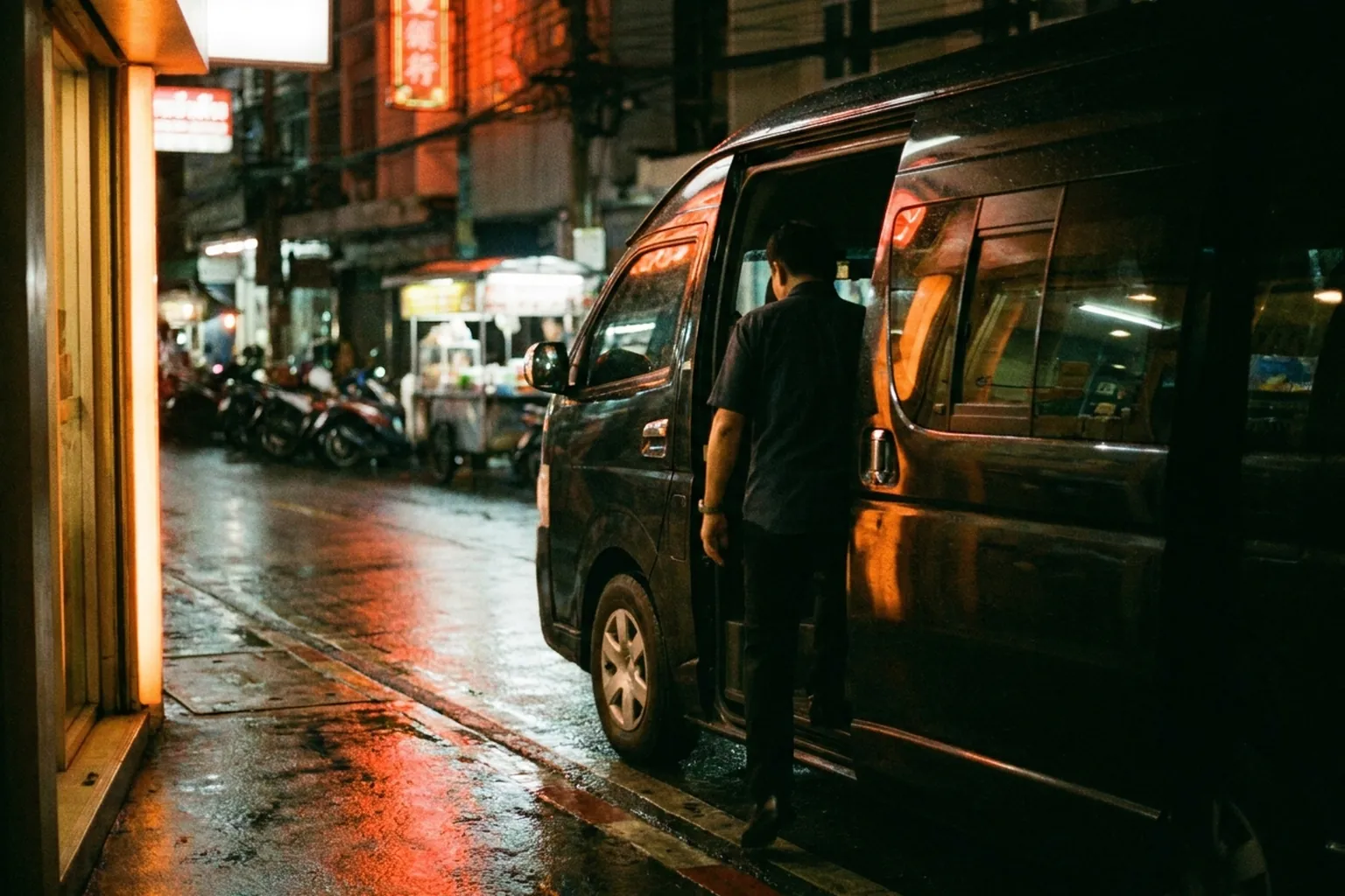 Boarding a private van on a Bangkok street after a night out