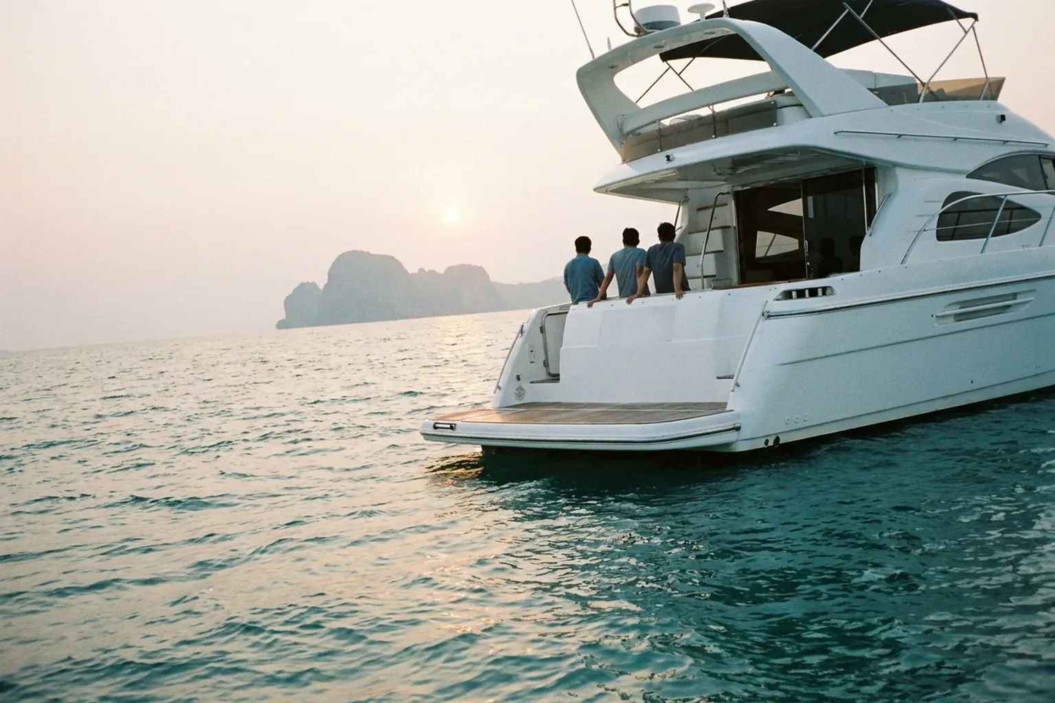 Private yacht charter anchored off a Thai island in the late afternoon